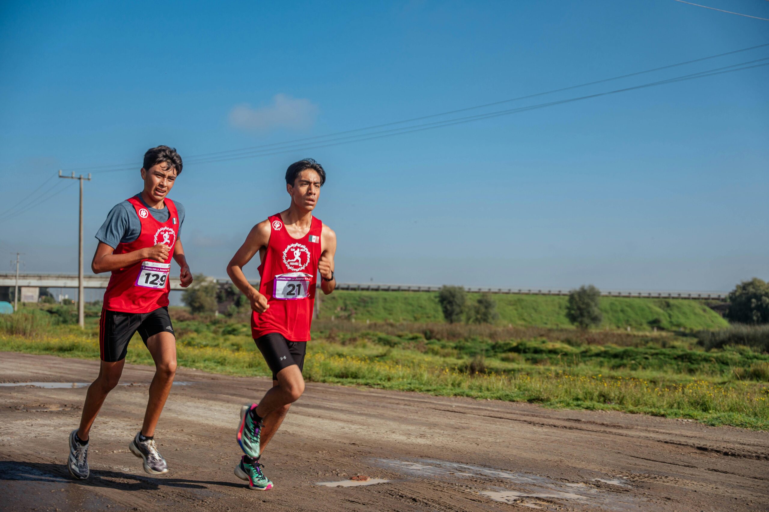 TWO PEOPLE RUNNING