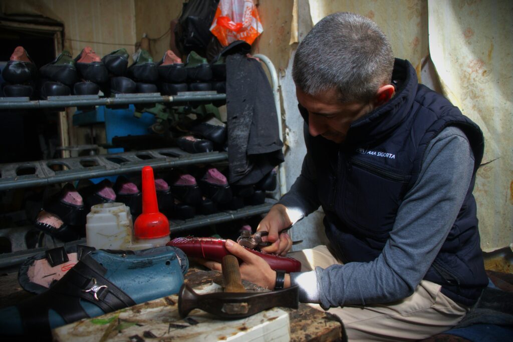 Pair of boots being resoled by a cobbler