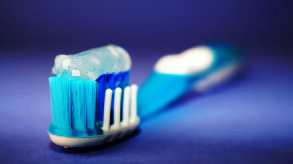 Removing a tough stain from a shoe using a toothbrush and baking soda