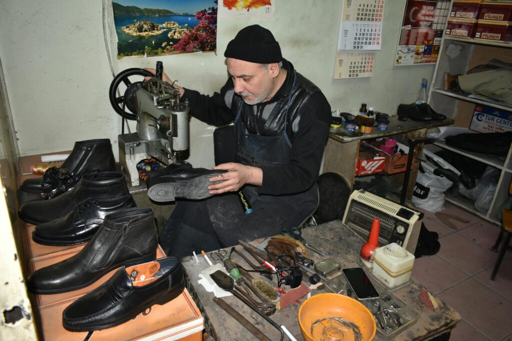 Shoe repair service in Washington Square with tools and polished shoes