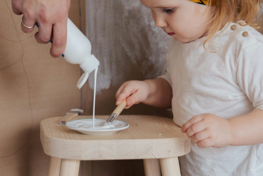 Bleach solution applied to white shoes for brightening and stain removal.