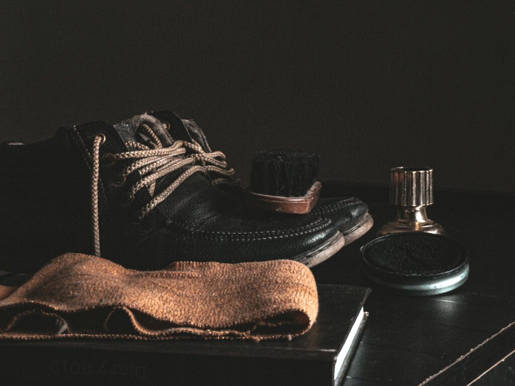 Leather sneakers being cleaned with a soft cloth and mild soap